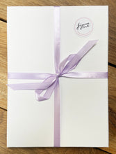 Load image into Gallery viewer, White gift box with lilac ribbon and Suzanne Pink sticker