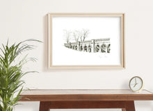 Load image into Gallery viewer, Detailed monochrome fineliner giclée print of the arches of the Italian Terraces, Crystal Palace Park, framed on a wall with wooden table, plant and clock.
