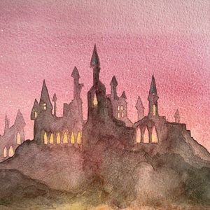 Harry Potter Hogwarts watercolour painting with silhouette and watercolour wash pink sky.