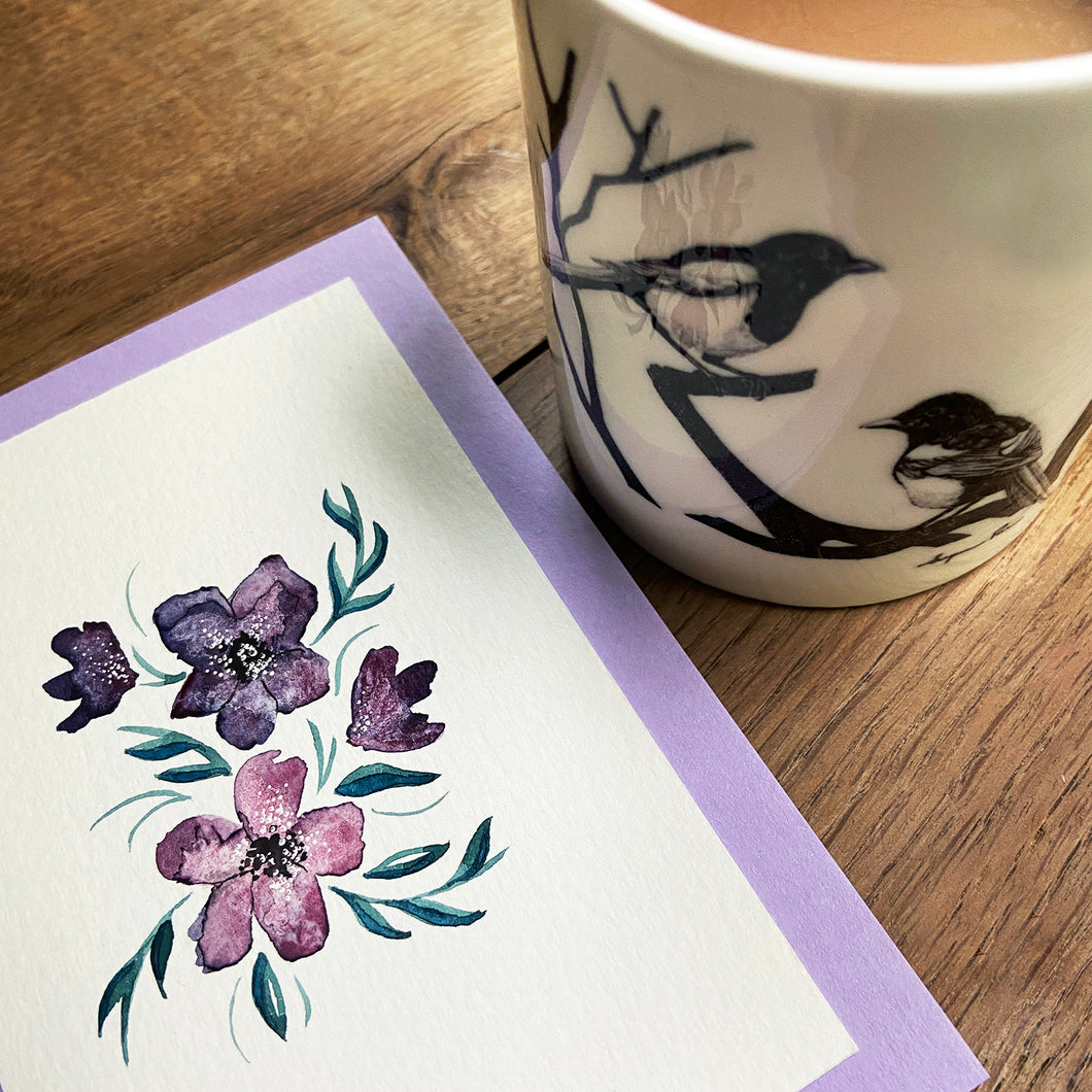 White fine bone china mug with two magpies illustration and handpainted watercolour and ink Mother's Day card.