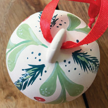 Load image into Gallery viewer, Handpainted ceramic Christmas bauble with mistletoe and fir branch design
