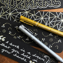 Load image into Gallery viewer, Bookmark designs using gold and silver pens. Geometric and dotted patterns and Neil Gaiman quote.
