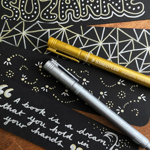Bookmark designs using gold and silver pens. Geometric and dotted patterns and Neil Gaiman quote.