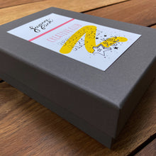 Load image into Gallery viewer, Doodler&#39;s Art Set grey gift box with label on wooden background.
