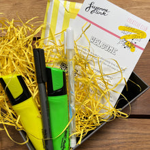 Load image into Gallery viewer, Doodler&#39;s Art Set with yellow and green highlighters, white gel pen and fineliner nestled in yellow recycled shredded paper.
