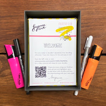 Load image into Gallery viewer, Doodler&#39;s Art Set with orange and pink highlighters, white gel pen and fineliner nestled in yellow recycled shredded paper.
