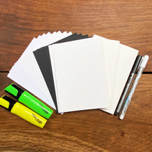 Load image into Gallery viewer, Doodler&#39;s Art Set with yellow and green highlighters, white gel pen and fineliner nestled in yellow recycled shredded paper.
