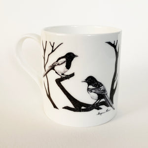 White fine bone china mug with two magpies design on white background